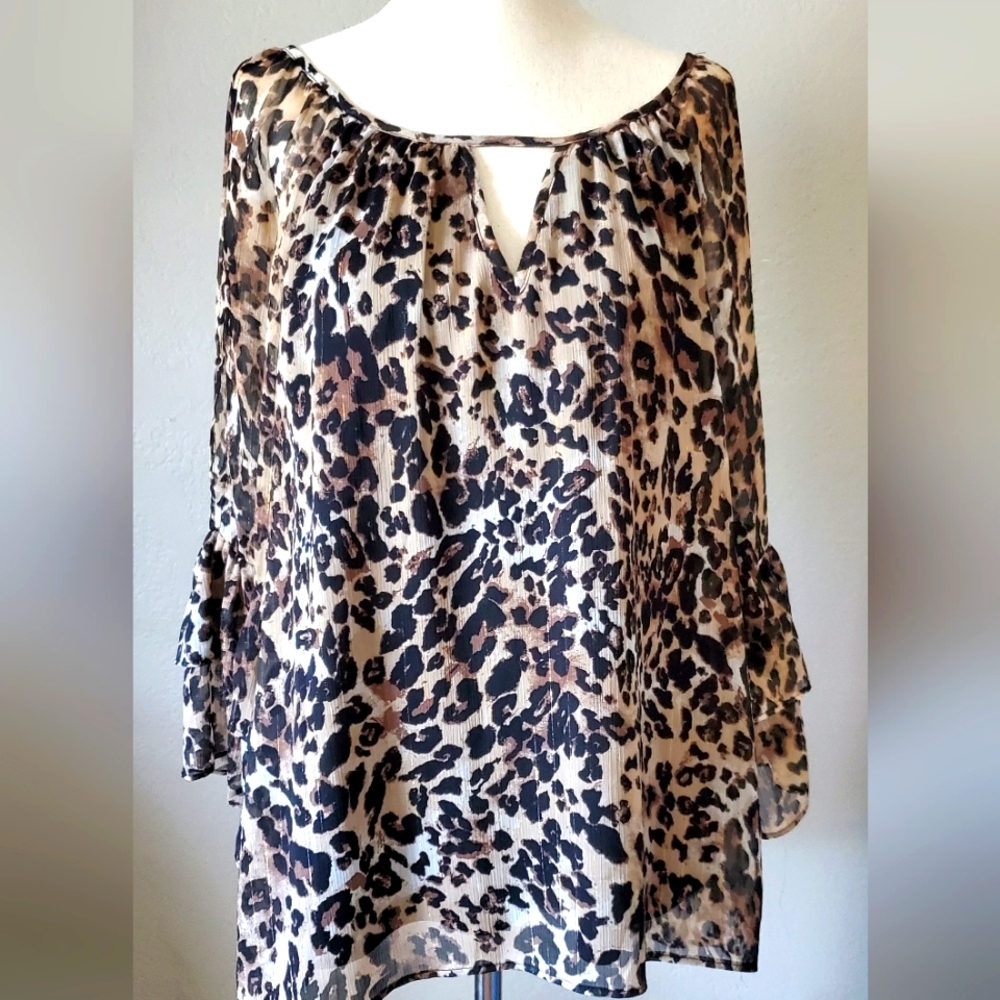 Animal print cold shoulder blouse.